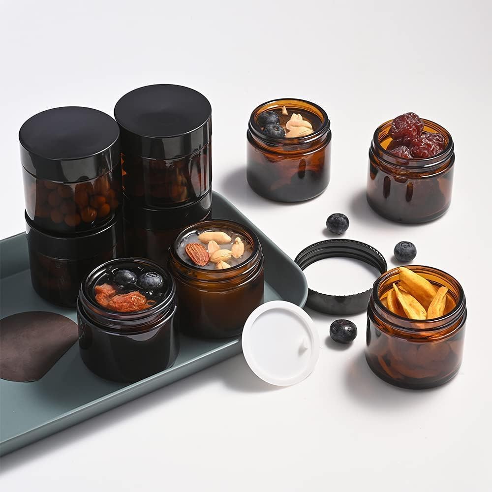 2 oz Round Amber Glass Jars, Bumobum 70 pack Cream Jars with Black Lids, Black and White Labels & Inner Liners, Empty Cosmetic Containers for Cream, Lotion